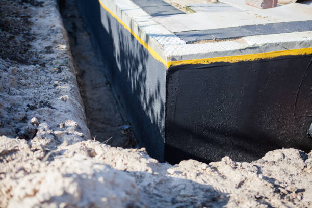 Professional Basement Waterproofing technician working in Paeonian Springs, VA